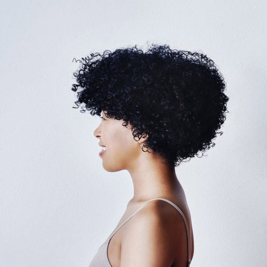 why do black women have extremely curly hair?